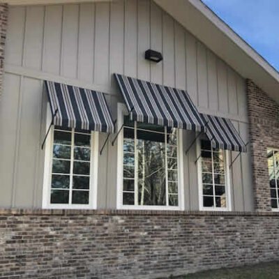 Fabric awnings complimenting windows